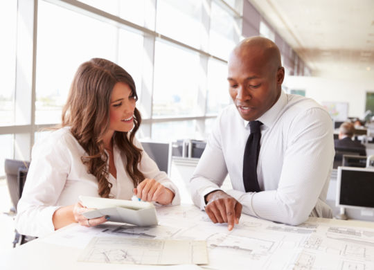 Man and woman working together in an architect?s office