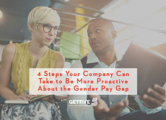 Team of young casual business people collaborating on an online project using a digital touchpad tablet computer in a bright modern office space. Serie with light flares