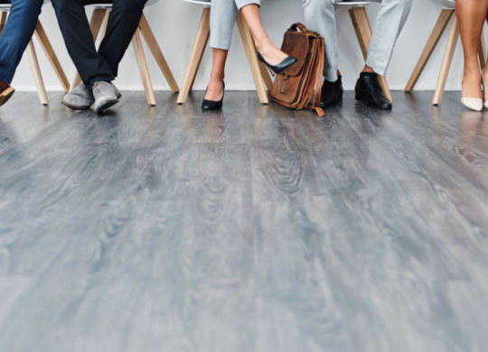 Cropped studio shot of a group of diverse businesspeople waiting in line