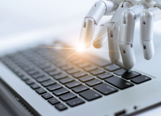 Robot finger point and working to laptop keyboard button, AI, Artificial Intelligence, Robotic hand on digital gray background. Futuristic technology concept. (Robot finger point and working to laptop keyboard button, AI, Artificial Intelligence, Robo