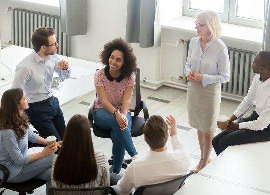 Business people employees group discussing work plan with coach mentor at corporate office meeting, multicultural workers sales team talking at company workshop training, top view overhead from above (Business people employees group discussing work pl